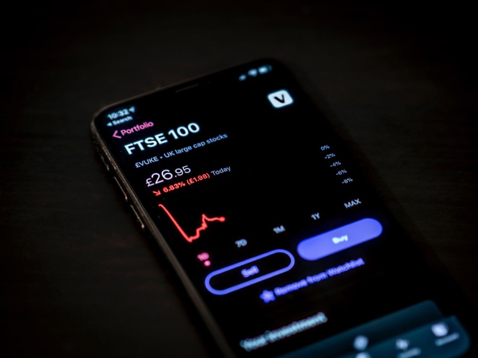 Phone screen showing crash in stock price Crypto Regulation