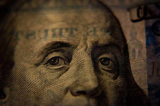 A closeup of a US hundred dollar bill, Benjamin Franklin side.Merchant Cash Advances