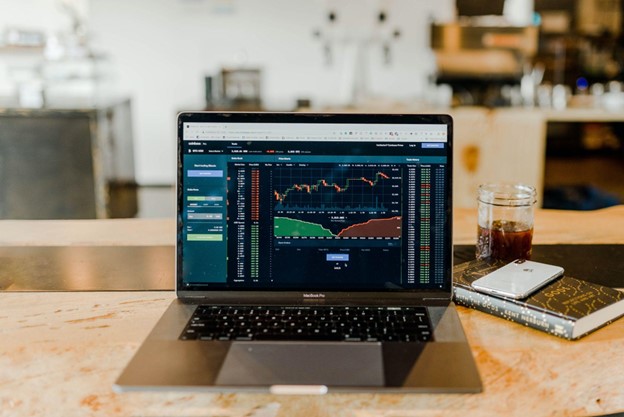 A laptop screen showing several line graphs most likely ready to start investing.