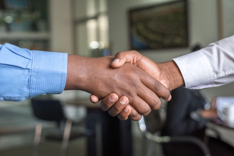 Two people shaking hands. Washington