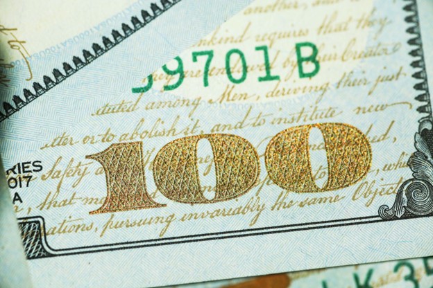 close up of gold leaf 100 dollar bill. Adding Merchant Cash Advances