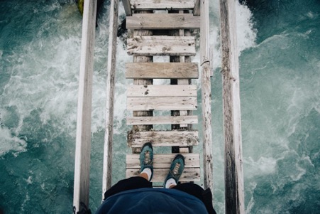 Aerial view of a bridge over choppy waters Economic Uncertainty