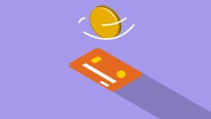 Credit card and coin on violet background