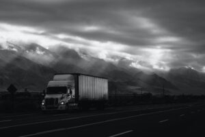 Tractor Trailer passing through the mountains Trucking