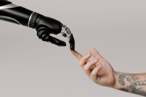 bionic hand and human hand finger pointing for ‘The USA's Economic Edge Over Europe: The Data’ US Economy