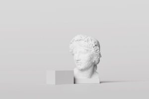 A white classical statue head next to a white cube for ‘Preparing for Economic Shifts Post-Fed Announcement’ Announcement