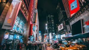 Exterior view of busy city street at night for ‘Unlocking Opportunities: Best Investments for Accredited Investors’