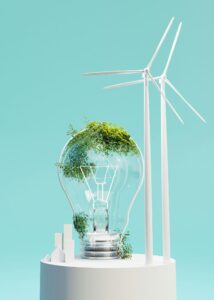 : An image showing wind turbines, a lightbulb and miniature houses on a podium, for “No More Missed Opportunities: Grow Your Capital While Staying Flexible”