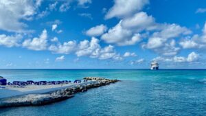 A sapphire ocean view with a luxury cruise ship in the distance, for “How Retirees with a Lump-Sum Pension Could Generate Income with the Note I”